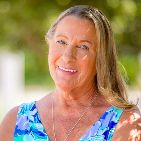 Marsh Cove Dental patient Donna and her beautiful smile after full mouth dental implants