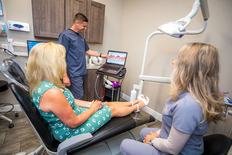Drs. Eugene & Olga Titov during a Smile Consultation with a patient of Marsh Cove Dental & Implant Center