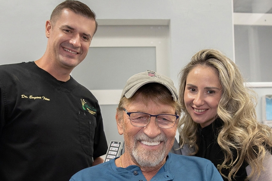Dr. Eugene Titov and Dr. Olga Titov with a Full Mouth Dental Implant Patient Post Surgery | Marsh Cove Dental